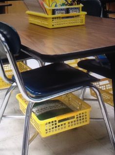 an image of a classroom table with yellow baskets on it and the text class room idea need book baskets but don't want to buy all new chairs af