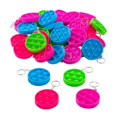 several pieces of plastic keychain shaped like waffles