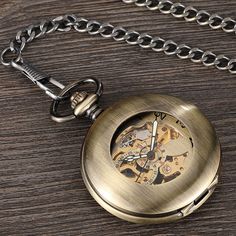 This pocket watch is seamlessly finished in bronze color to give it that vintage look everyone wants. Featuring a mechanical hand-wind movement, this analog timepiece has a special area for jazzing up your style. The skeleton structure in this pocket watch makes it look wonderful. You can always add a pop of fashion to your look with this watch. 

Specifications
Item Type: Pocket & Fob Watches
Case Material: Stainless Steel
Style: Antique
Gender: Unisex
Feature: mechanical pocket watch
Dial Diam Vintage Bronze Metal Pocket Watch, Gold Pocket Watch With Metal Dial, Gold Pocket Watch With Skeleton Dial, Vintage Brown Watch With Skeleton Dial, Gold Steampunk Watch With Skeleton Dial, Steampunk Metal Pocket Watch For Formal Occasions, Gold Round Pocket Watch With Antique Finish, Antique Gold Round Pocket Watch, Antique Finish Gold Pocket Watch