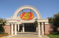 the front entrance to a store with an arch and sign that says, jelly belly