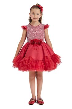 This charming Girls Red Christmas Dress is an eye-catching piece for the festive season. It features a bodice adorned with delightful faux pearls and sequins that mimic a snowfall on a winter's day, perfect for capturing the magic of the holidays. The shoulders are sweetly accented with soft ruffles. At the waist, there's an intricate gathering of red flowers centered with sparkling beads. A full, layered tulle skirt with a frilly hem is made for twirling at holiday parties. The tulle overlay gi Girls Red Christmas Dress, Plated Dress, Girls Christmas Dress, Red Christmas Dress, Red Pearl, Layered Tulle Skirt, Girls Red, Girls Christmas Dresses, Ruffle Skirt