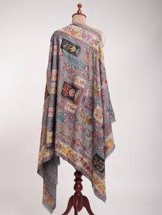 Embrace the perfect blend of tradition and contemporary design with this Art Silk Embroidered Indian Pashmina Jamavar Shawl. Crafted from the finest Pashmina, this shawl offers an opulent, soft texture that brings warmth and comfort, ideal for both formal events and everyday wear. The elegant gray base is adorned with intricate Art Silk embroidery, featuring detailed Jamavar patterns that reflect centuries-old Indian artistry. Each motif is carefully hand-embroidered, using shimmering silk threa Luxury Chikankari Pashmina Shawl For Festivals, Jamavar Designs, Gray Art, Intricate Art, Grey Art, Pashmina Shawl, Silk Embroidery, Embroidered Silk, Soft Texture