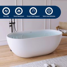 a large white bathtub sitting on top of a wooden floor next to a rug