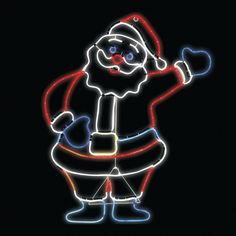 a lit up santa clause standing in the dark