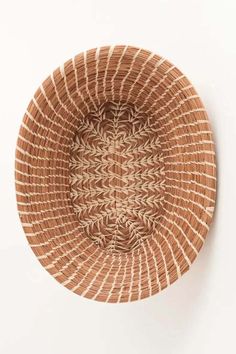 a woven basket is shown on the wall, and it looks like an intricate design