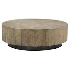 a round wooden table with black metal base on an isolated white background for use as a coffee table