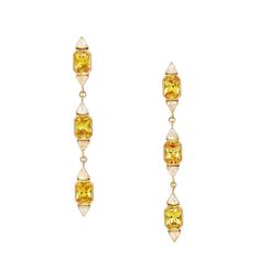 6 Radiant Scissor Cut Yellow Sapphires Weighing: 2.77 Carats 12 Trillion Diamonds Weighing: 0.48 Carats Total Gem Weight: 3.25 Length: 2 1/8" Width: 1/8" Set in 18 Karat Yellow Gold Overall Weight: 6 grams Gold Diamond Drop Earrings, Trillion Diamonds, Scissor Cut, Fancy Yellow Diamond, Diamond Dangle Earrings, Radiant Cut Diamond, Artisan Earrings, European Cut Diamonds, Radiant Cut