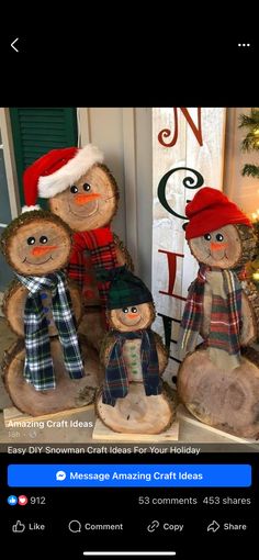 three stuffed animals sitting next to each other in front of a christmas tree and sign