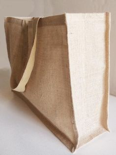 a bag made out of burlock on a white surface