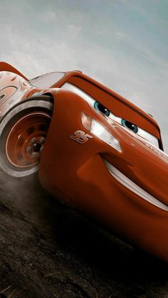 the character cars from disney pixar are racing