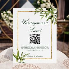 the wedding stationery is decorated with greenery and gold foiling, along with qr code