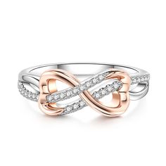 a white and rose gold ring with diamonds in the shape of an intertwined knot