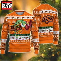 an orange sweater with the logo of san francisco rapp on it is hanging from a christmas tree