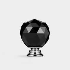 a black diamond knob on a white background