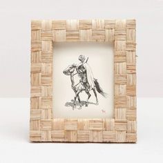 a drawing of a man riding a horse in a basket frame on a white background