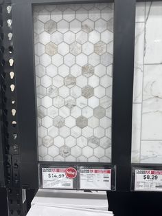 some sort of tile on display in a store for $ 2 99 per square foot