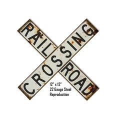 an old railroad crossing sign with rusted metal letters