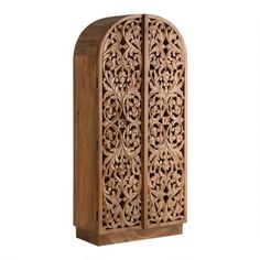 an ornate wooden cabinet with carvings on the front and side panels, made out of wood