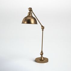 an antique brass desk lamp on a white background with clipping light from the side