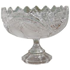 a clear glass bowl on a white background