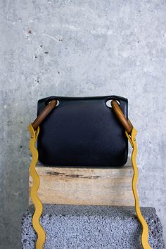 The Mini Neneh bag is a petite bag perfect for all occasions. It features wood handles that give the bag a unique feel while the smooth calf leather adds an elegant touch. The crossbody strap is made of grained yellow leather. Details & Care Main Colour: Black Product Composition: Shell: 100% Calf Lining: 65% PA 35% PU Product Care: Spot Clean Only Country of Origin: Italy Sizing & Fit Sizing System: W20cm-H15cm-D4cm Product Composition, Parcel Service, Wood Handles, Yellow Leather, Bag Bag, Crossbody Strap, Calf Leather, Bosnia And Herzegovina, Handles