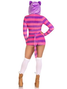 a woman in a pink and purple striped cat costume is standing with her hands on her hips