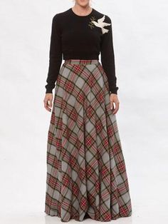 The Claire Plaid Skirt is a cotton flannel bias circle skirt with an invisible side zipper closure and 2" waistband. This cotton flannel skirt is a limited edition offering in our deadstock fabric category. Deadstock fabrics are end of roll fabrics from production and fit into our sustainable fabric category as they are rescued from potential destruction or landfill. The Claire skirt is vegan and is a great holiday skirt. Show off your waistline by pairing it with the Cropped Peace Dove Sweater Flannel Skirt, Holiday Skirt, Studded Sweater, Deadstock Fabric, Holiday Skirts, Peace Dove, Sustainable Fabric, Plaid Skirt, Plaid Skirts