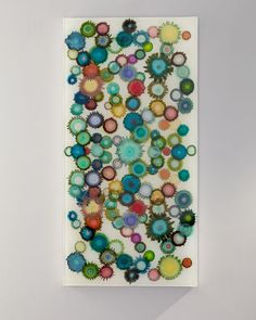 an art piece with many different colored circles on it