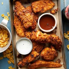 chicken wings with dipping sauce and potato chips