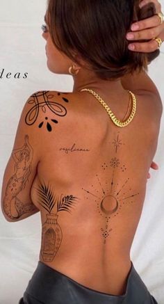 the back of a woman's body with tattoos on her upper and lower half