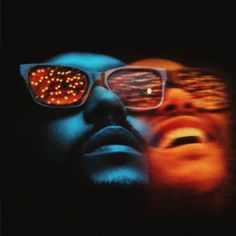 two people wearing glasses with their eyes glowing in the dark