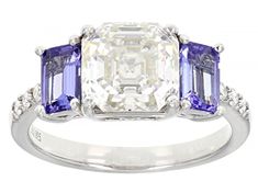 Moissanite Fire(R) 3.08ctw diamond equivalent weight asscher cut and round with .85ctw octagonal cut tanzanite, Platineve(R) ring. Measures approximately 5/16" L x 1/16" W and is not sizeable. Actual moissanite weight is 2.37ctw. Comes with certificate of authenticity. Platinum Diamond Ring With Asscher Cut Gemstone, Gia Certified Asscher Cut Sapphire Ring, Luxury Asscher Cut Sapphire Ring, Asscher Cut Diamond Ring In Platinum, Asscher Cut Diamond Platinum Ring, Asscher Cut Diamond Ring With Gemstone, Dazzling Asscher Cut Diamond Ring, Tanzanite Asscher Cut Ring With Prong Setting, Jewelry Television