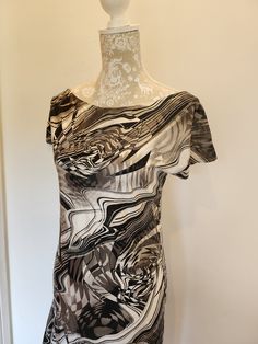 one off unique item. stand out in a crowd! white and black monochrome modern abstract printed dress. scooped neckline and short sleeve. backless with tie detail. loose fitting with asymmetrical full skirt shape. made from a lovely printed fabric with a subtle clear holo dot pattern on.  fabric has a slight stretch but isnt really stretchy like lycra. would fit uk size 12/14 Modern Short-sleeve Summer Dress, Modern Short Sleeve Summer Dress, Rave Dance, Black Monochrome, Modern Abstract Print, Backless Long Dress, Abstract Print Dress, Scooped Neckline, Festival Dress