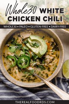 a bowl of chicken chili with avocado and cilantro