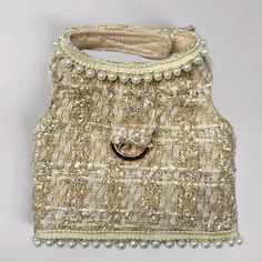 a handbag with pearls and beads on it