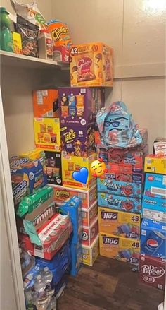 a closet filled with lots of different types of boxes and snacks on top of shelves