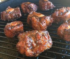 some meat is cooking on a grill and it looks like they have been grilled