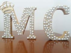 the letters m and n are made out of pearls