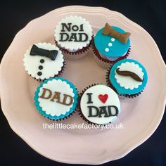 a plate that has cupcakes on it with the words i love dad written on them