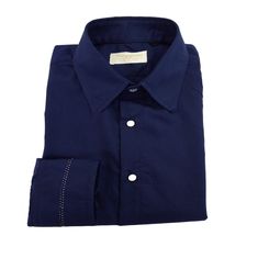 The elegance of the sartorial shirt with Italian collar, which immediately enhances the style of the wearer. Provided with Italian collar, back yoke with two high pleats and straight cuffs with particular central silver-colored stitching. Regular fit.  Fabric: stretch cotton 97% cotton, 3% elastane, blue color 101b011 from the color chart. Hand wash warm water 30 - 40 degrees. Do not bleach. Do not tumble dry. Lukewarm iron max 110 degrees c. Dry clean delicate with perchlorethylene. Do not professional wet clean. Line dry in the shade.  All our items are handmade and packaged one at a time, designed and produced in limited quantities in our laboratory in Irsina (MT) in Italy with exclusively MADE IN ITALY fine fabrics.  This item is put into production after your order, following your mea Navy Cotton Dress Shirt For Business, Designer Blue Shirt For Formal Occasions, Elegant Navy Cotton Shirt, Navy Cotton Dress Shirt For Work, Blue Cotton Business Shirt, Formal Blue Buttoned Shirt, Classic Navy Cotton Dress Shirt, Formal Blue Shirt With Buttons, Blue Business Shirt With Spread Collar