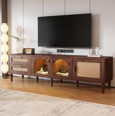 PRICES MAY VARY. Rattan Entertainment Center - This sleek rattan TV Stand with LED lights blends Mid-Century Modern and Scandinavian style, making it the ideal TV console for a wide range of modern decor. You'll love the rattan door/drawer face design that adds a tropical and stylish feel to your living room. Versatile Storage Space - This wooden TV stand provides plenty of storage options with 2 drawers and 3 cabinets, both of which are ideal fo Modern Wood Tv Stand, Media Console Cabinet, Mcm Media Console, Mcm Tv Console, Black Entertainment Center Living Room, Boho Tv Stands Living Rooms, Tv Console Ideas Living Rooms, Media Console Living Room, Tv Console Storage