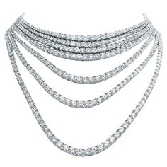 A statement masterpiece. A stunning tennis necklace features a collection of Diamonds , each more mesmerizing than the last. The array of diamonds creates a sparkling and radiant piece of jewelry that is sure to catch the eye and make a bold statement. The elegant style exudes sophistication and grace , making it the perfect accessory for any formal occasion. Elevate your collection with this extraordinary piece; it is an epitome of luxury and elegance. A true masterpiece, it embodies sophistica Tennis Necklace Diamond, Riviera Necklace, Italian Jewelry Designers, Contemporary Necklace, 18k Gold Necklace, Italian Jewelry, Necklace Diamond, Emerald Necklace, Tennis Necklace