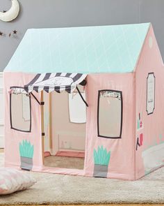 a child's play tent with a cactus theme on the front and side walls