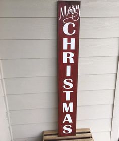 a wooden sign that says merry christmas on it