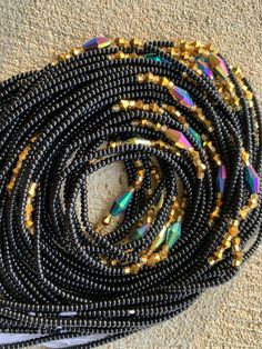 "Hi there! Thanks for your interest in these Czech waist beads. Please read below for detailed information on the listing: 🌼 This Listing is for 25, 35 and 60 strands of quality waist beads. 🌼 Length varies from 40\"- 45\" 🌼 All Beads are Tie On 🌼 You will receive almost identical beads in the pictures listed with slight variation. 🌼 All Wholesale Ship Directly from Ghana, Africa. 🌼 Retail, that is single strands ship directly from the US. 🌼 Beads are made with Strong cotton or Polyester Faceted Beaded Bracelets For Party, Party Beaded Chain Necklace With Metal Beads, Faceted Beaded Bracelet For Party, Party Beaded Necklace With Metal Beads, Party Metal Beaded Chain Necklaces, Bohemian Round Beads For Party, Faceted Round Beads For Festival, Bohemian Beaded Waist Beads For Parties, Multi-strand Black Beads For Party