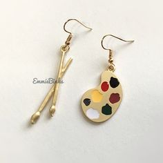 New Golden Artist Painter Earrings Features A Mismatched Trendy Design With 1 Side: Dual Paint Brush & Side 2: Paint Palette Would Make A Fantastic Gift For Any Artist! Approx Measurements: Brush: 2 In H W Drop Palette: 1.5 H New In Package ~ Removed Only To Photograph! This Listing Part Of This Month’s 3 For $28 Sale ~ Add To A Bundle & I’ll Adjust Your Price! (Or Send The Offer Yourself)! Now With Discounted Shipping!! Other Notes~ Coordinating Necklace Now Available In A Separate Listing Jewe Owl Necklace Silver, Fox Earrings, Brush Paint, Bat Earrings, Golden Painting, Ghost Earrings, Gothic Earrings, Bronze Earrings, Earring Box