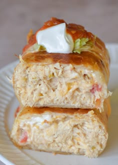 two pieces of food sitting on top of a white plate