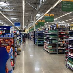 an aisle in a grocery store filled with lots of items