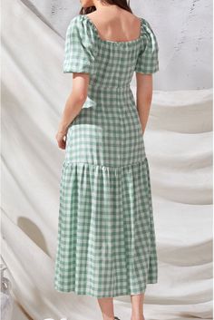 Best Seller 
  Fit & Flowy 
  Self¨C 100% Polyester and Lining¨C 100% Rayon 
  Hand Wash Cold. Dry Flat 
  Midi Length 
  V-Neckline 
  Puffy Sleeves with Elastic Cuffs 
  Back Elastic Waistband 
  Elastic Shoulders 
  Flowy Skirt 
  Back Tie Closure 
  Lined Through Half Skirt 
 
//Best Seller// The print of the summer! Our Rye Puff Sleeve Gingham Midi Dress comes in hunter green and white complete with back tie closures.

Styled with: Perfect Hoop Earrings. 5 Disc Choker. Chloe Mini Neckla Gingham Midi Dress, Simple Bangle, Mini Necklace, Casual Chique, Party Dress Long Sleeve, Half Skirt, Puff Sleeve Dresses, Necklace Simple, Gingham Dress