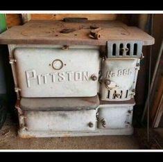 an old fashioned stove sitting in a room